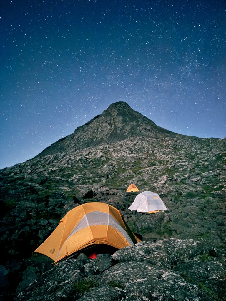 Tents set up under a starry sky on Mount Pico, offering a magical overnight camping experience in the Azores.